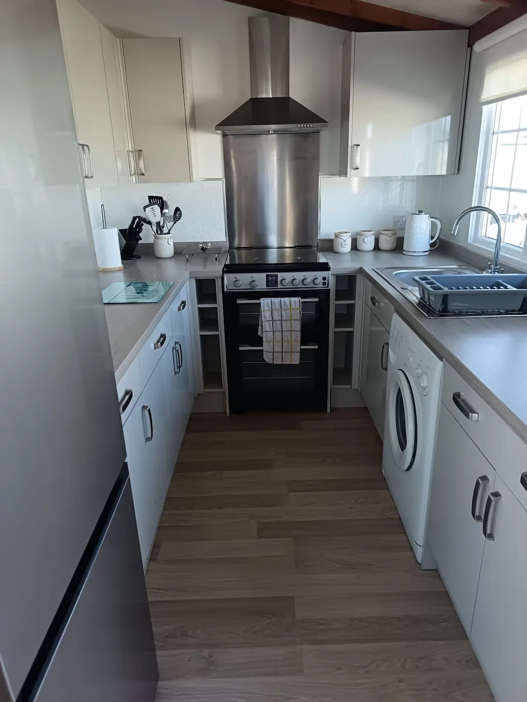 Kitchen with cooker and fan